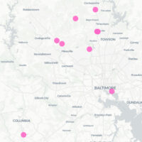 Map of Baltimore with pins marking 10 plastic surgeon locations for tummy tucks.