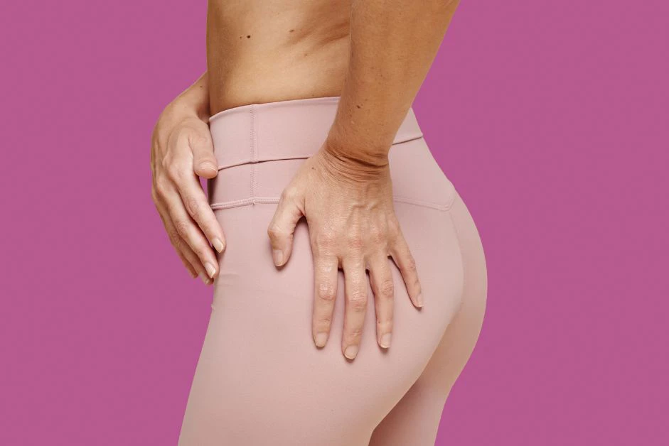 Woman in pink leggings, Brazilian butt lift surgeon questions article.